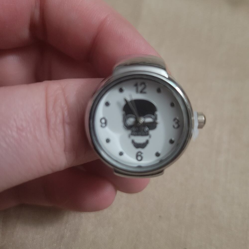 Skull face white and silver watch ring